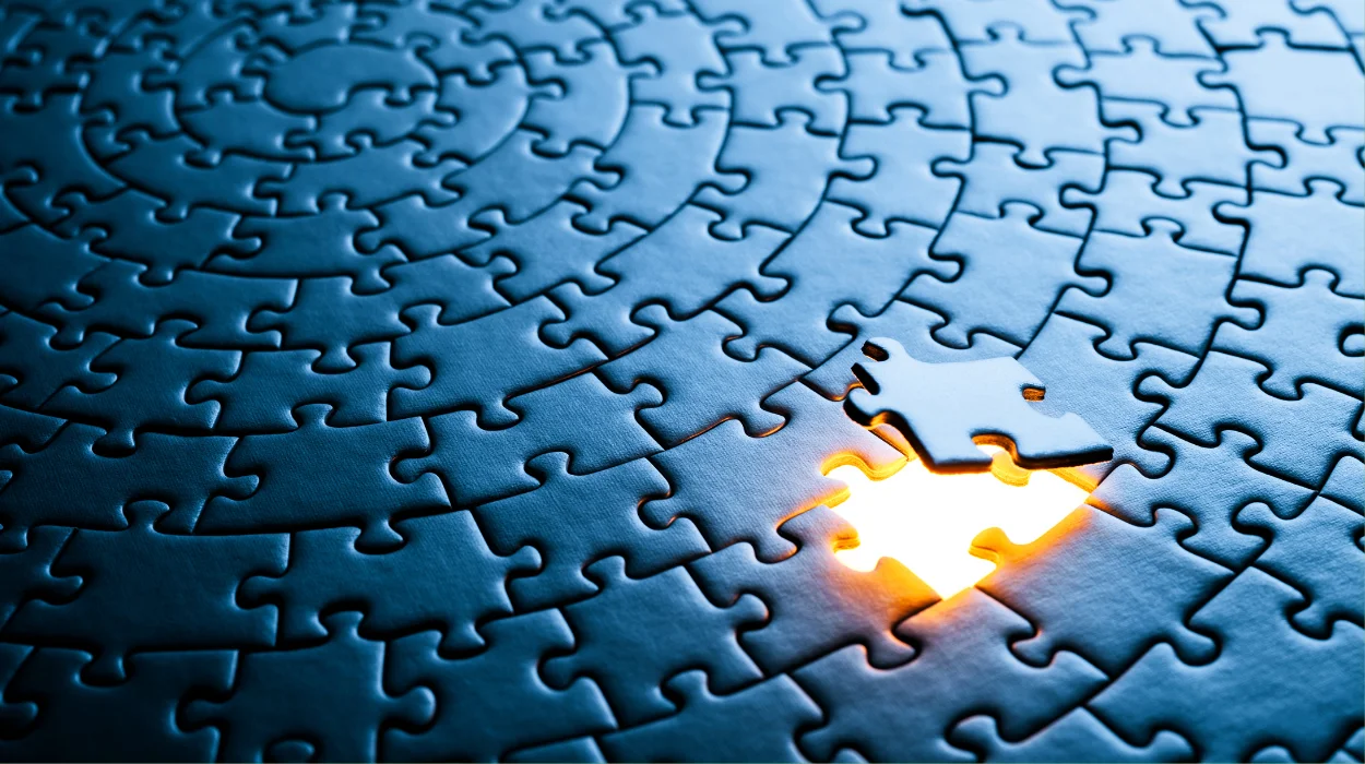 ): The last piece of a puzzle falling into place symbolizing the completion of the cybersecurity puzzle.