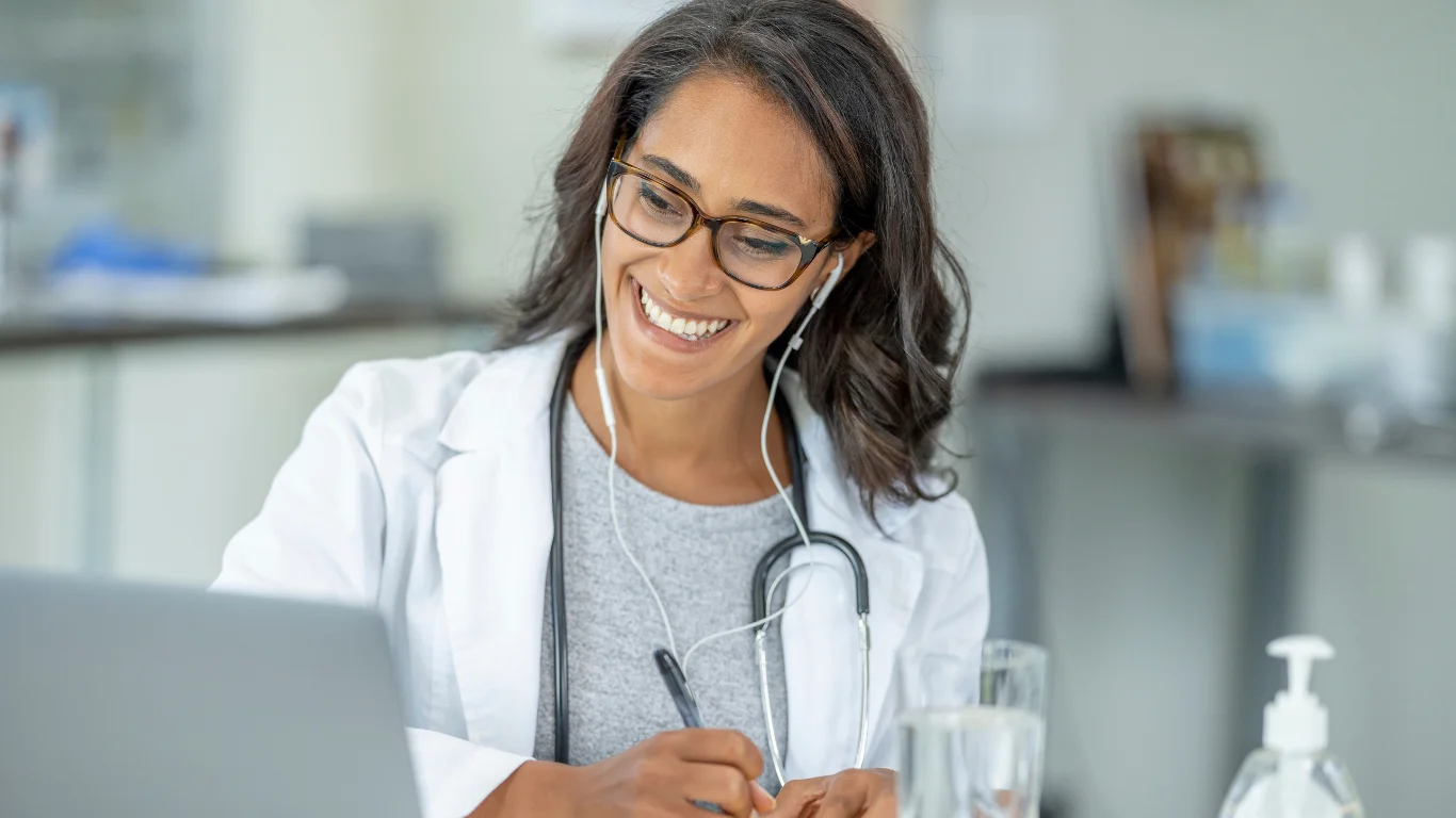 Doctor on telehealth call A doctor able to take telehealth calls knowing her network is protected with TAGs IT services