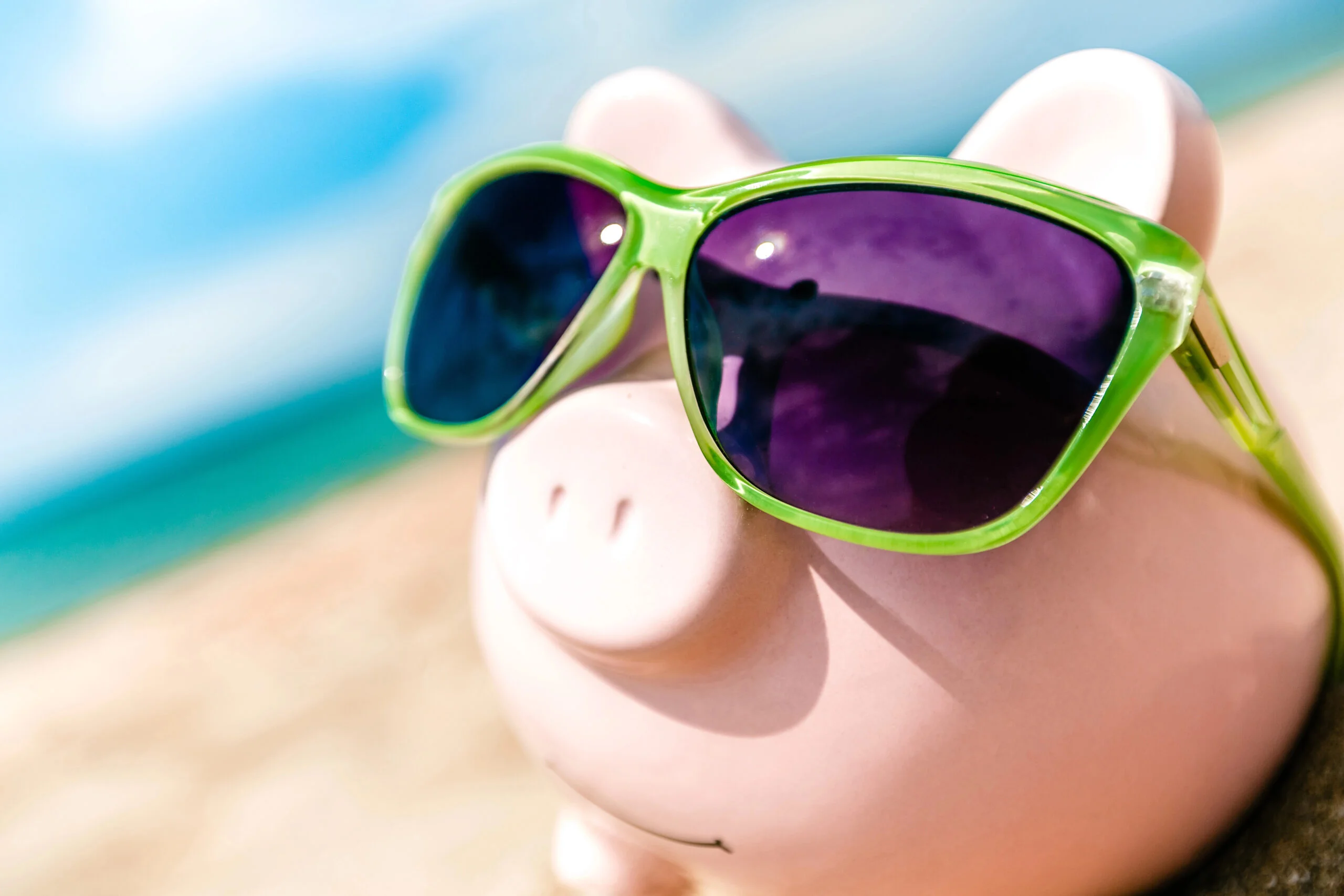 Piggy bank in sunglasses showing the hidden costs of cheap IT support services.
